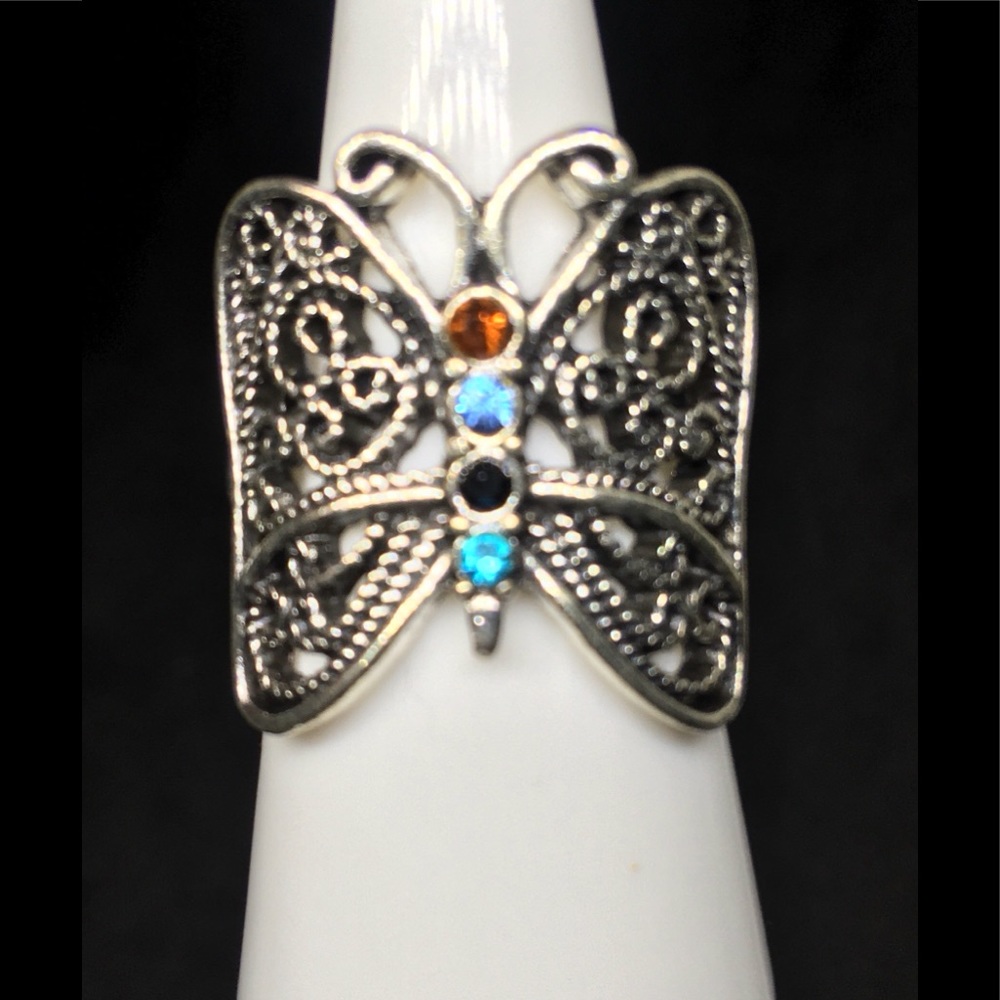 Silver Butterfly With Gemstones Going Down The Spine Of The Ring